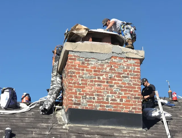Miami Chimney Sweep installing a custom chimney crown in Miami, FL