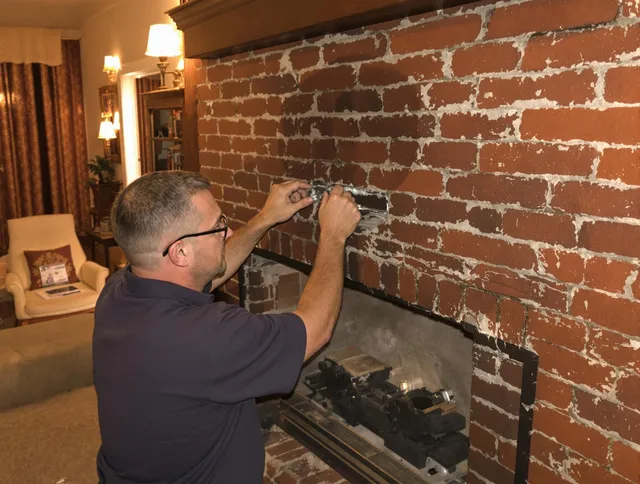 Miami Chimney Sweep expert fixing a fireplace in Miami, FL